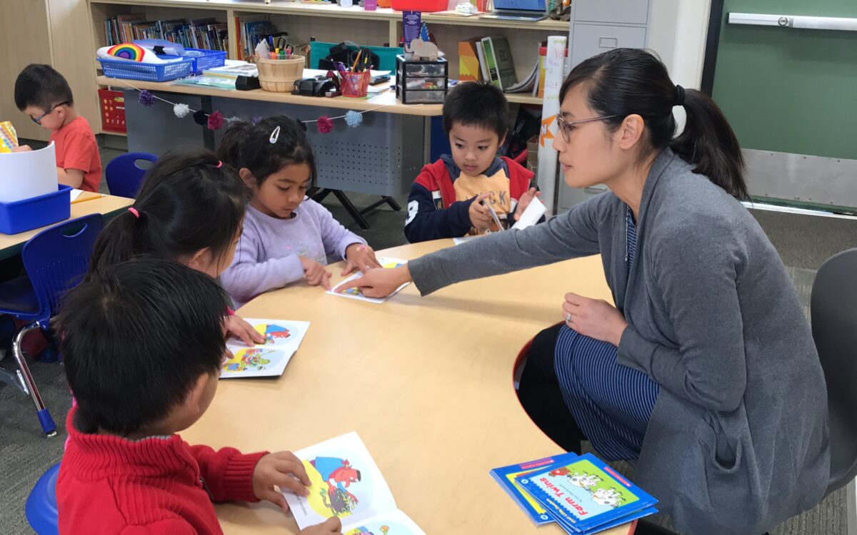 Teacher Nancy Yue works with children in the Vietnamese-English dual immersion program at Windmill Springs Elementary in Franklin-McKinley School District in San Jose.